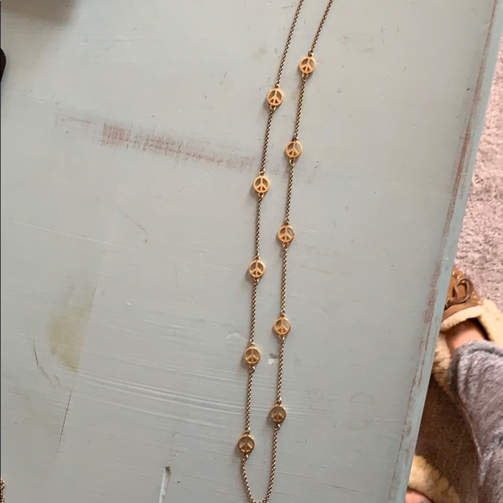 Long gold peace necklace